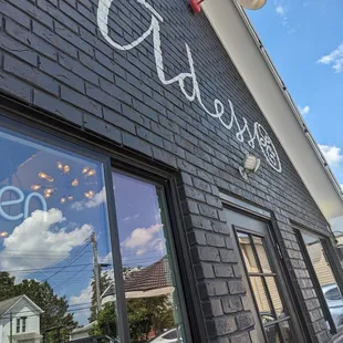 the reflection of a woman in the window