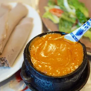 a plate of food and a bowl of soup