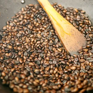 roasted coffee beans in a wok