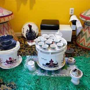 a table with tea cups and saucers