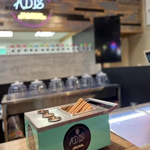 Churro carrito with sprinkles, chocolate and lechera