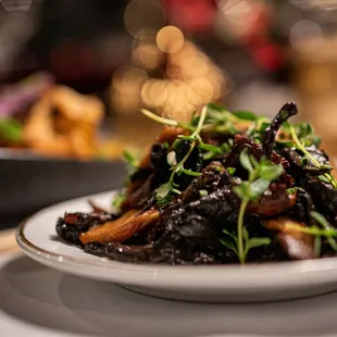 Mixed mushrooms (shiitake, chanterelles, morels) with black garlic. Ask your server for Mushroom Variation if you love mushrooms as much as