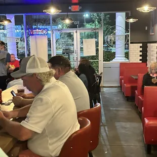 Sit at the counter or find a small table. Not so great for large groups.