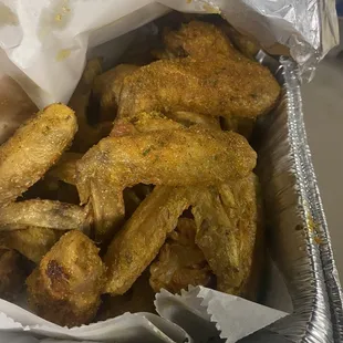 chicken wings in a foil container