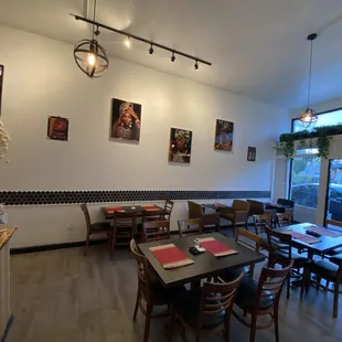 a dining room with tables and chairs