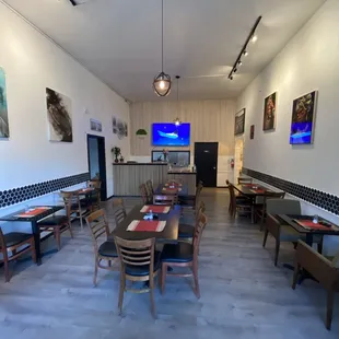 a dining room with tables and chairs