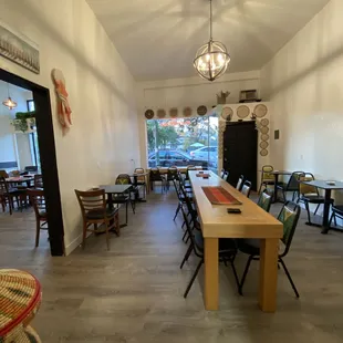 a dining room with tables and chairs