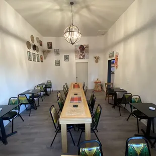 a dining room with tables and chairs