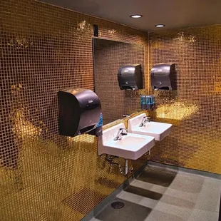 Gold tiled bathrooms! Photo by Patrick Robinson