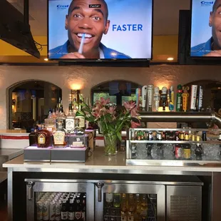 two televisions above the bar