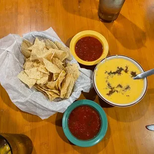 Chips , Salsa, Queso with seasoned ground beef