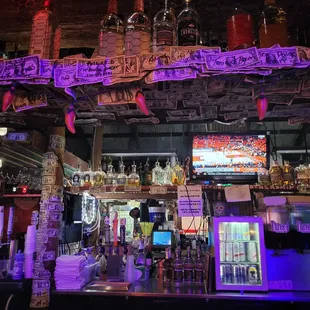 a bar with purple lighting