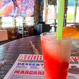 a drink on a table in a sports bar