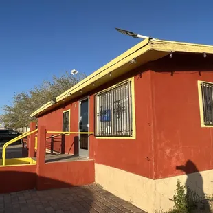 a red building with yellow trim