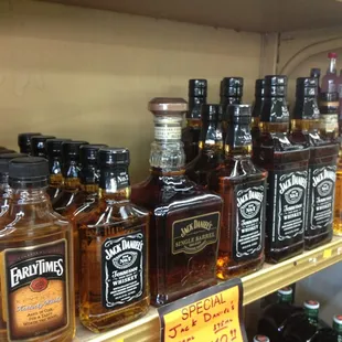 a shelf of liquor bottles