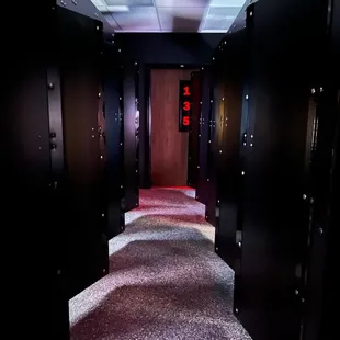 a hallway with a red carpet