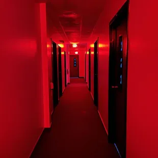 a hallway with red lighting
