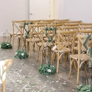 Grand Hall Room seats 90 guests with Adorn X-back chairs, faux garland, and lanterns included! Need more seating? Ask us about our room flip