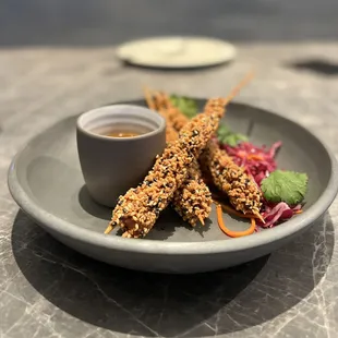 Crispy Sesame Shrimp w/ spicy soy + ginger dipping sauce ($16)