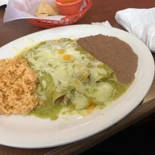 Enchiladas verdes with chicken fajita. Excuse the salsa that dripped on top their salsa is also delish.