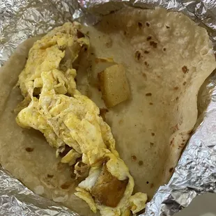 Potato and egg taco on flour