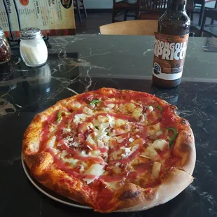 Hawaiian pizza with jalapenos added.