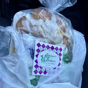 a sandwich wrapped in plastic