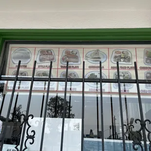 a window with plates of food on it
