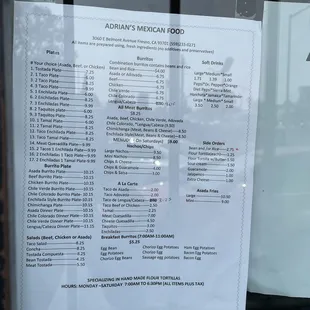 a menu in a restaurant window