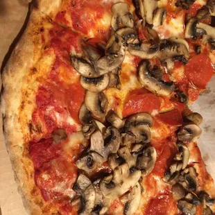 a pizza with mushrooms and cheese