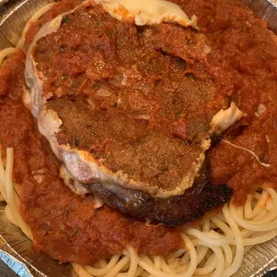 a plate of spaghetti with meat and sauce