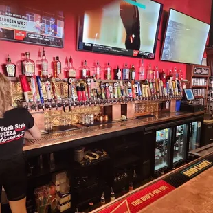 a woman behind the bar