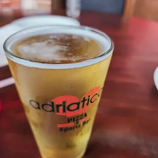 a glass of beer on a table
