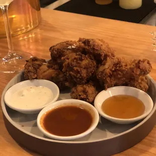 Fried Chicken Wings. Dipping sauces: blue cheese, Buffalo sauce, honey