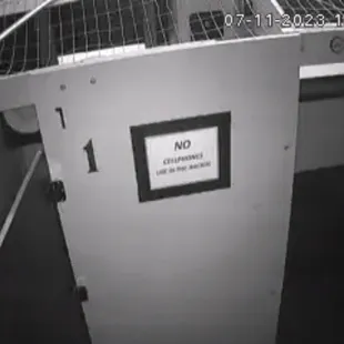 a jail cell with a sign on the door