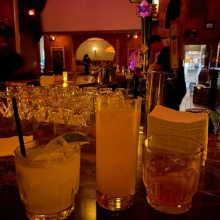 a table with drinks and glasses on it