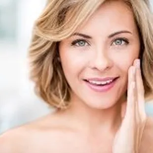 Advanced Dermatology &amp; Skin Cancer Specialists - woman smiling with hand on face