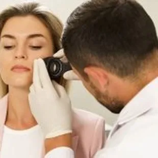 Advanced Dermatology &amp; Skin Cancer Specialists - doc examining womans face