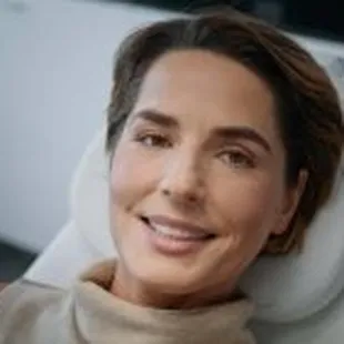 Advanced Dermatology &amp; Skin Cancer Specialists - woman smiling on derm chair
