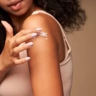 Advanced Dermatology &amp; Skin Cancer Specialists - woman spreading cream on arm