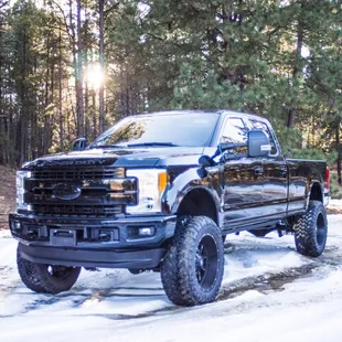 Completely blacked out 2018 Ford F350. We painted the bumpers, grille, and emblems to give this truck a clean, seamless look.