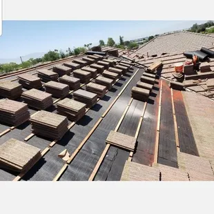 Replacement of existing felt with new felt new wood battens