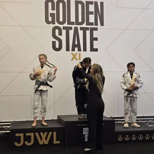 Getting 1 of her 2 GOLD medals!!