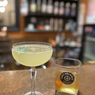 a glass of lemonade next to a glass of lemonade