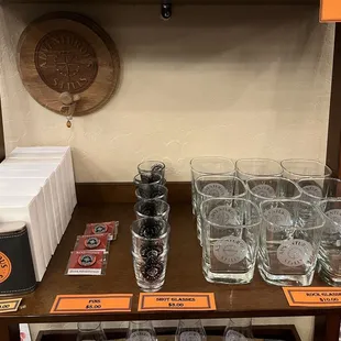 Merch area- flasks, shot glasses, and rocks glasses