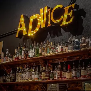 a shelf of liquor bottles