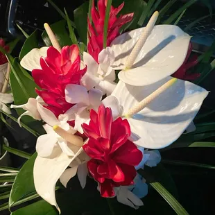 Bridal bouquet of tropical flowers and greenery.