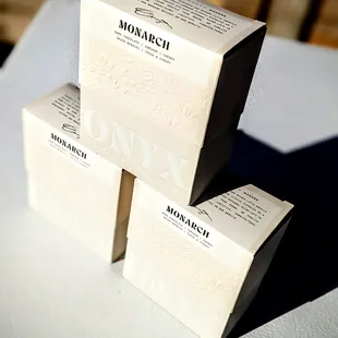 three boxes of coffee on a table