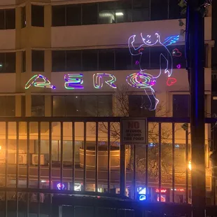 The roof top bar has its name displayed on the adjoining property in this cool fashion.