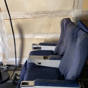 2 chairs in the FedEx plane